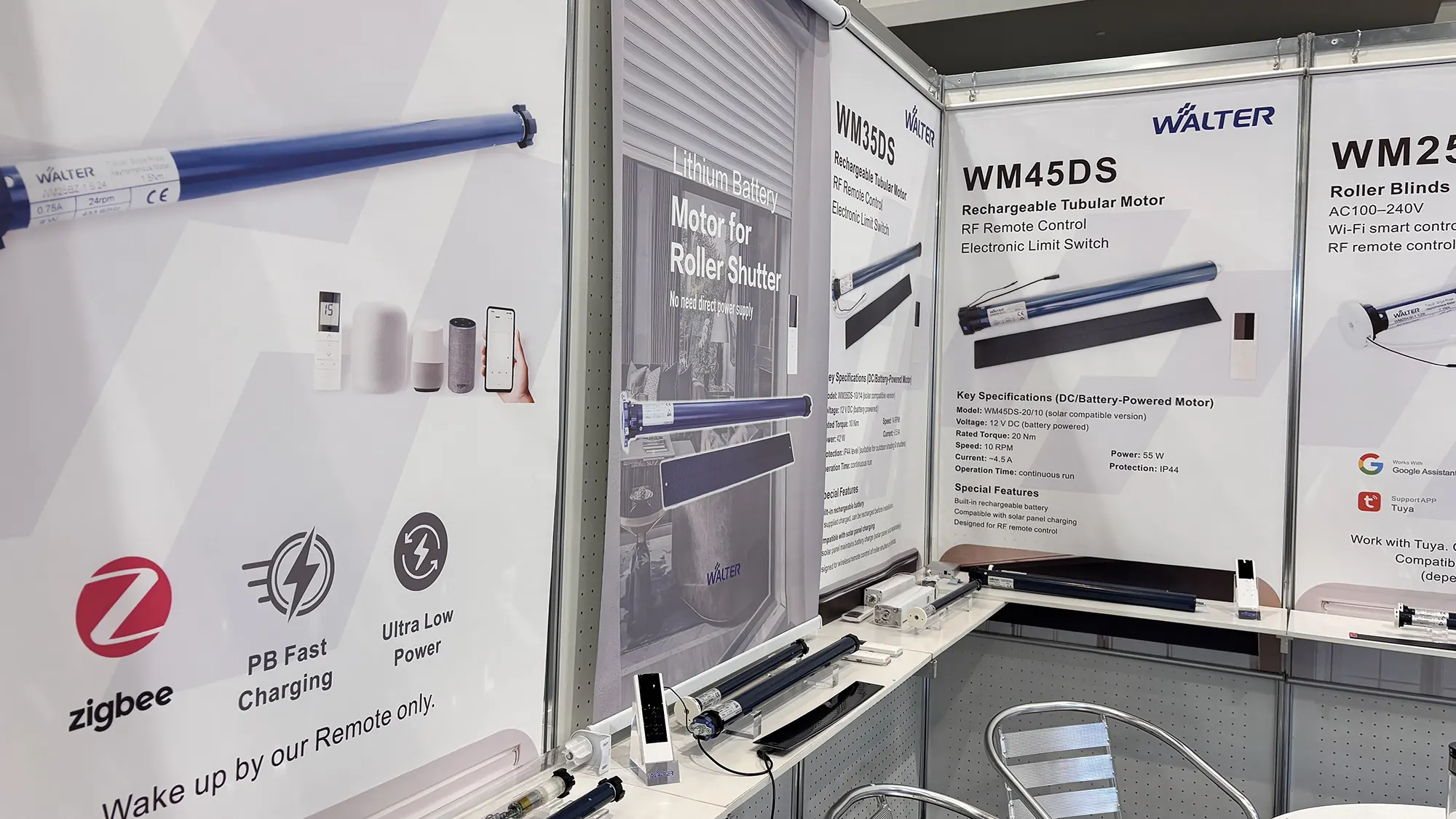 Walter Motor team discussing OEM roller shade motor solutions with IWCE visitors